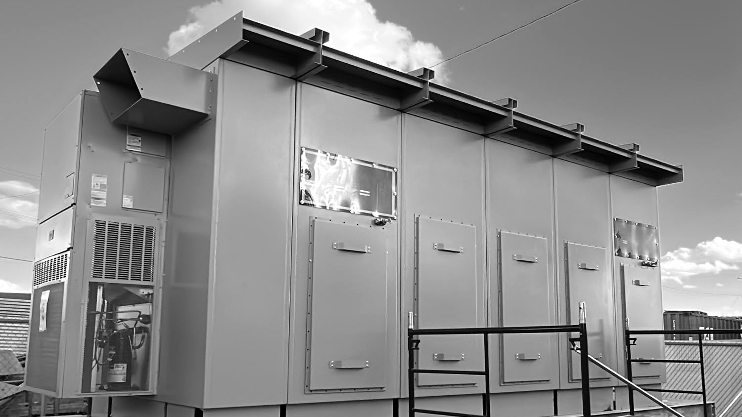 Outdoor 15 kV class generator switchgear lineup with integrated HVAC, staged before shipment
