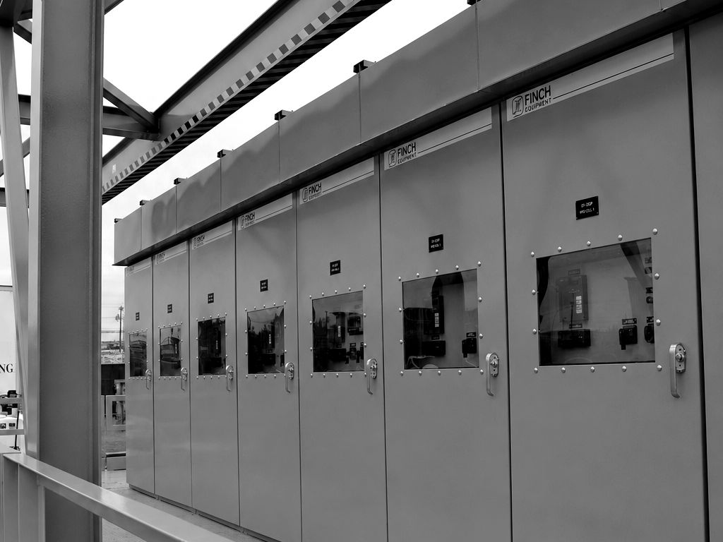 Finch-built outdoor walk-in switchgear lineup with platform and handrail
