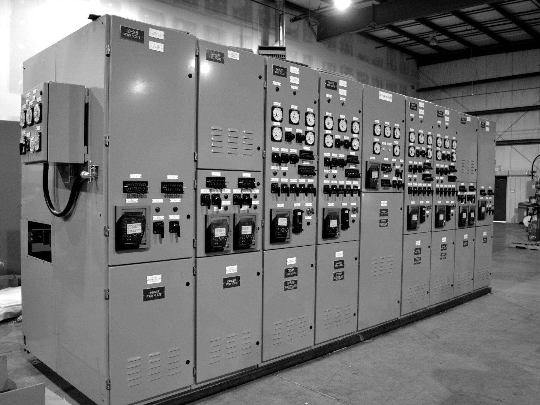 Long indoor metal-clad lineup with protective relays and metering on the shop floor